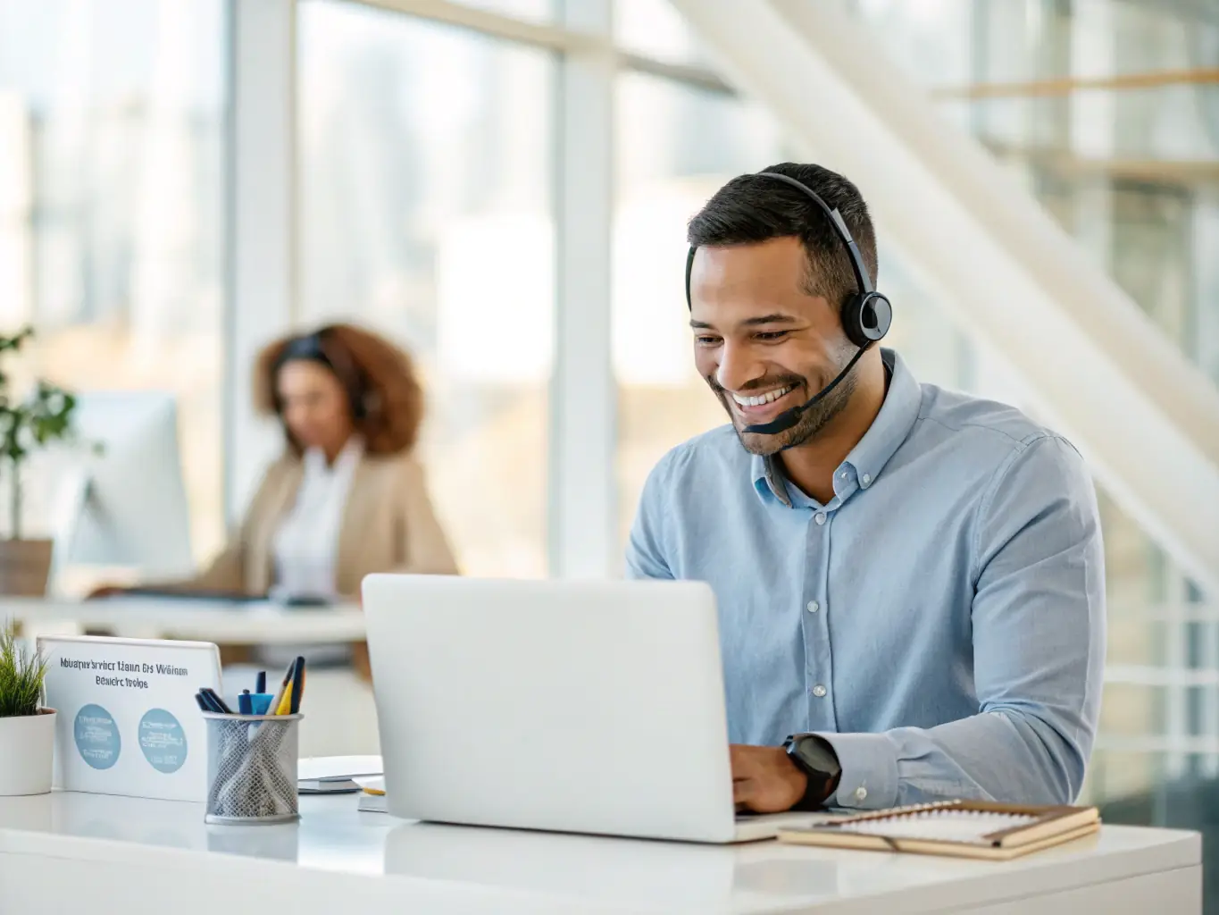 A friendly customer support agent assisting a client with their booking on a laptop, showcasing the ease and efficiency of the booking process.